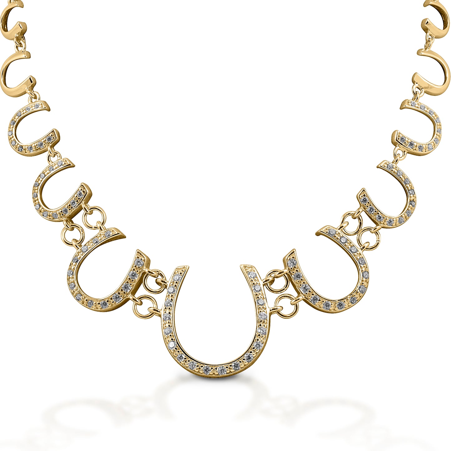 The Kelly Herd Multi Horseshoe Necklace links progressively sized horseshoes, creating a lovely frame affect. The larger horseshoes are enhanced with diamonds. Features Linked horseshoe chain Diamonds 14k Yellow Gold 22mm wide x 19''
