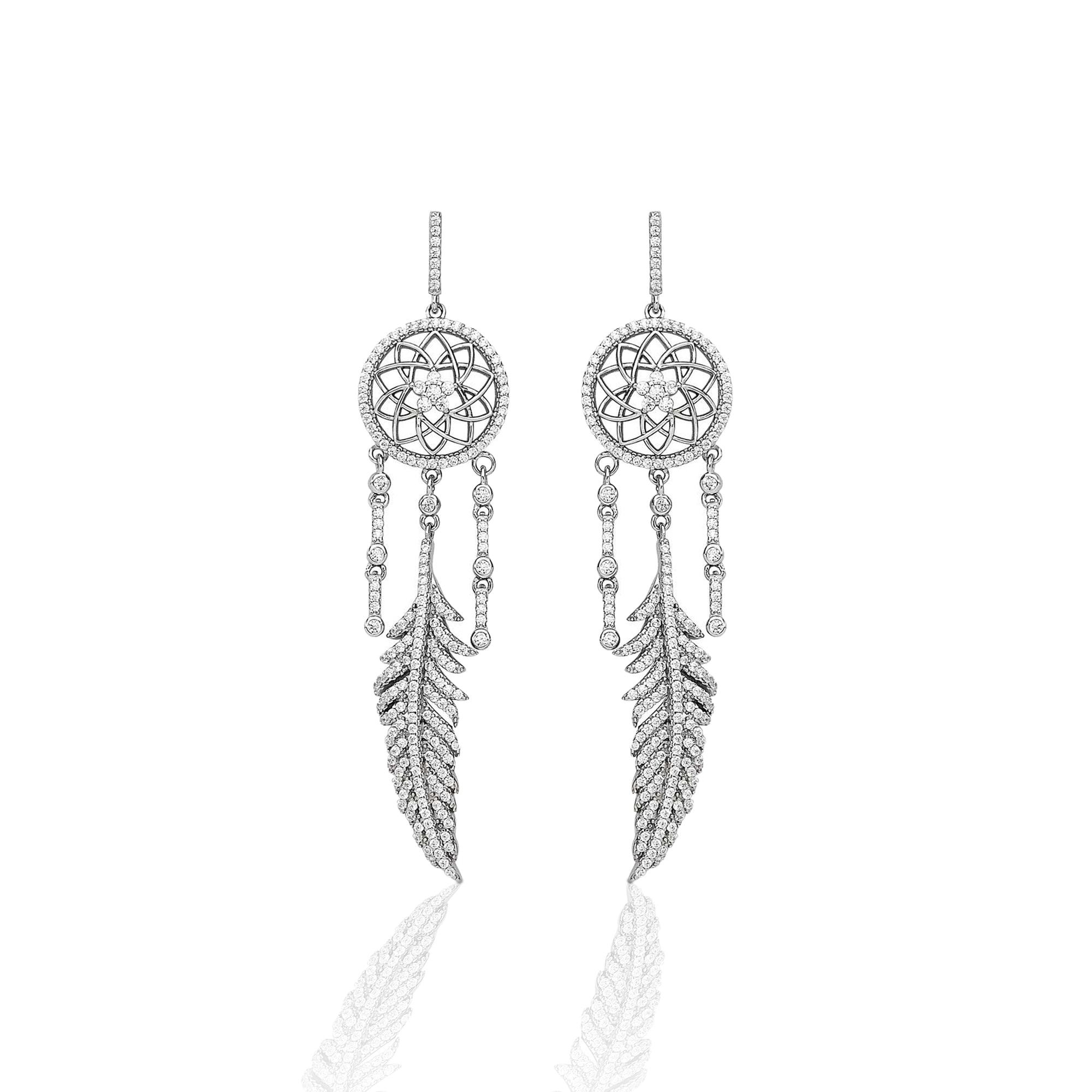 The traditional dream catcher is truly a symbol of the Southwest. We designed the Kelly Herd Dream Catcher Dangle Earrings to evoke that protective nature. Our design is accented with dazzling silver feathers and clear cubic zirconia stones. Make dreams come true by adding the matching necklace!     Features      Intricate Dream Catcher Design     Clear Cubic Zirconia Stones     Measures 55mm high and 20mm wide     Post Back     Sterling Silver