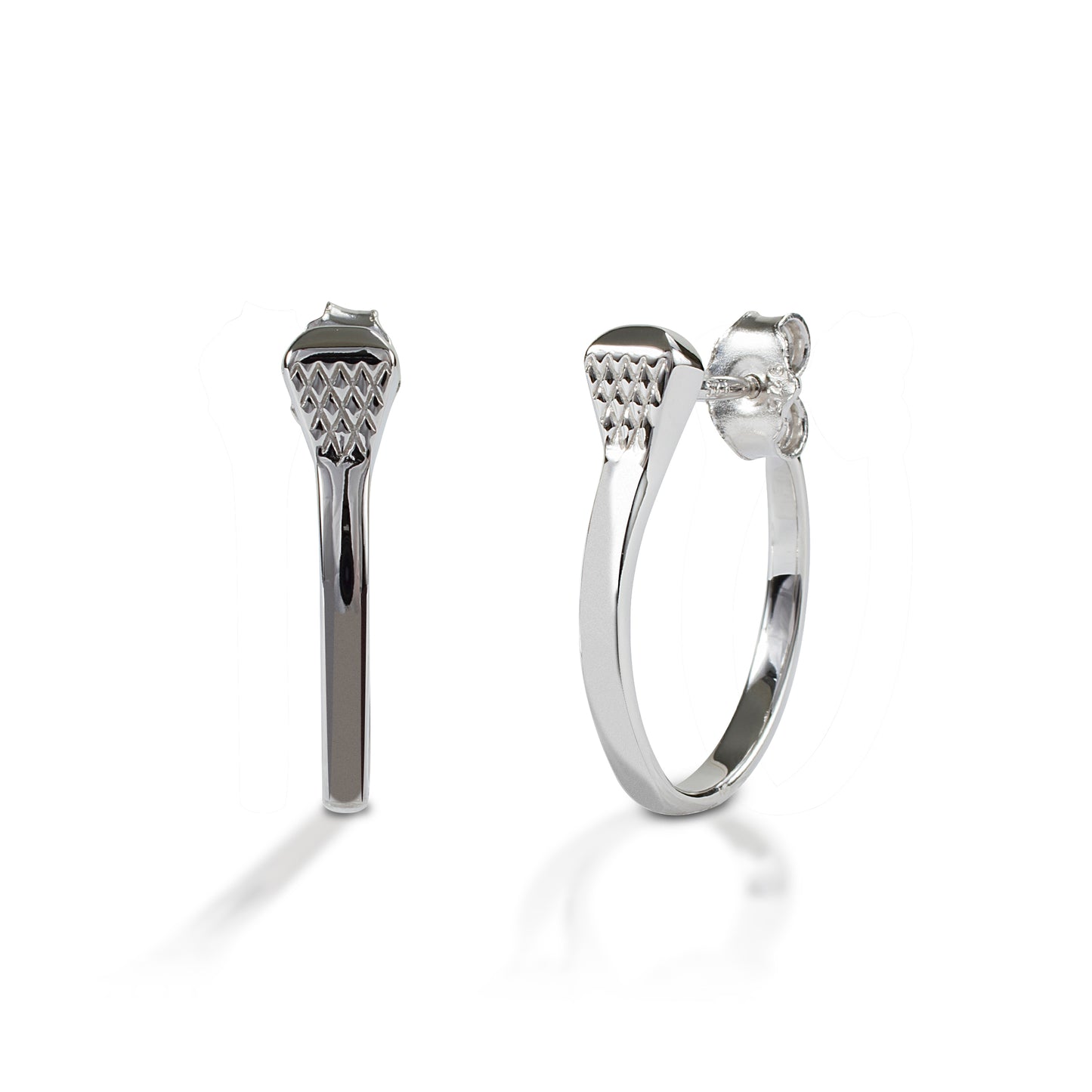 Wear just a touch of equestrian style with Kelly Herd's Horseshoe Nail Earrings. Made in your choice of white, or yellow 14k gold, these horseshoe nails are turned into a smooth hoop shape. Only the most observant horse person will recognize the nail head! Post backs for comfortable wear. Features Horsehoe nail earrings Available in white, or yellow 14k gold Post backs 4mm x 18mm