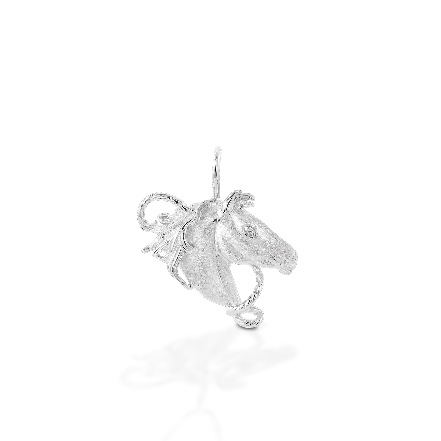 With a long mane and a lasso, the Kelly Herd Horsehead Pendant captures the spirit of the old West. Available in 14K gold. Features Horsehead & rope pendant Available in 14K gold Diamonds 30mm x 22mm