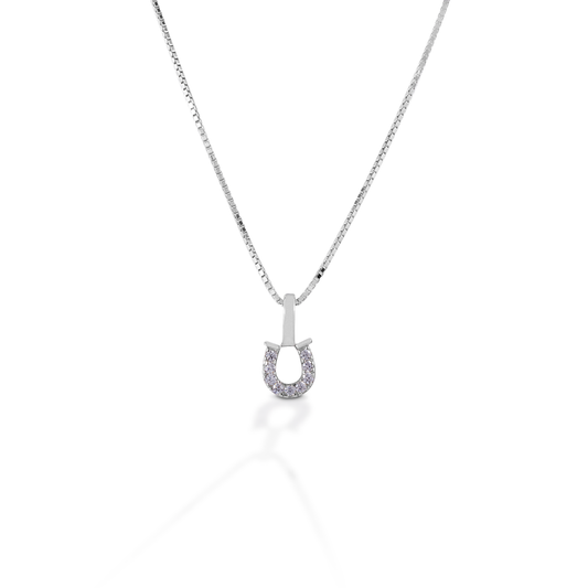 The Kelly Herd Clear Horseshoe Necklace features a delicate sterling silver pendant enhanced with clear CZ stones set in a horseshoe. Perfect for taking a little luck into the ring with you! Comes with 16-18" adjustable chain.  Features      Delicate horseshoe pendant.     Clear cubic zirconia stones     Sterling silver     Adjustable Chain     8mm x 8mm