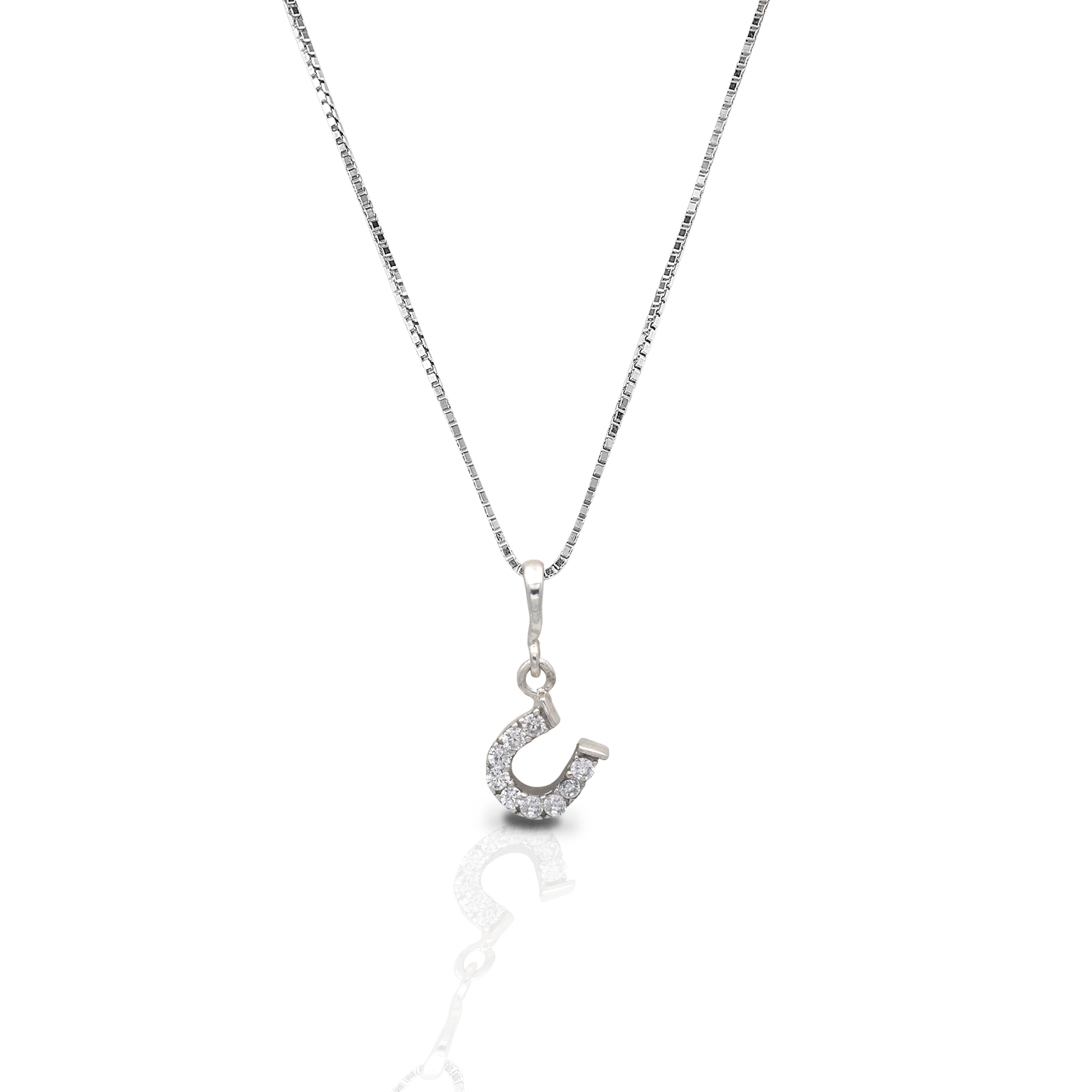 The Kelly Herd Clear Dangle Horseshoe Necklace features a beautiful offset sterling silver horseshoe pendant enhanced with clear CZ stones. Perfect for taking a little luck into the ring with you! Comes with 16-18" adjustable chain.  Features      Delicate horseshoe pendant.     Clear cubic zirconia stones     Sterling silver     Adjustable Chain     8mm x 8mm