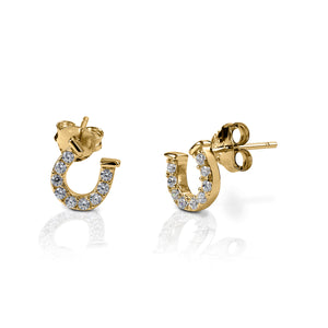 Kelly Herd Clear Horseshoe Earrings are delicate gold horseshoes enhanced with diamonds. Perfect for taking a little luck into the ring with you!  Features      Delicate horseshoe earrings     Diamonds     Available in white gold, or yellow gold     Matching ring and necklace available     8mm x 8mm