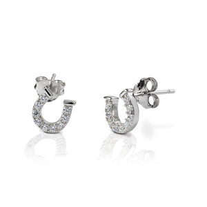 Kelly Herd Clear Horseshoe Earrings are delicate sterling silver horseshoes enhanced with clear CZ stones. Perfect for taking a little luck into the ring with you!  Features      Delicate horseshoe earrings     Clear cubic zirconia stones     Sterling Silver     Matching ring and necklace available     8mm x 8mm