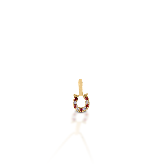 The Kelly Herd Red & Clear Horseshoe Pendant features a delicate gold pendant enhanced with ruby and diamond gemstones set in a horseshoe. Perfect for taking a little luck into the ring with you!  Features      Delicate horseshoe pendant.     Ruby and diamonds     Available in 14K gold     8mm x 8mm
