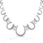 The Kelly Herd Multi Horseshoe Necklace links progressively sized horseshoes, creating a lovely frame affect. The larger horseshoes are enhanced with clear CZ stones. Sterling Silver  Features      Linked horseshoe chain     Clear cubic zirconia stones     Sterling Silver     22mm wide x 19''