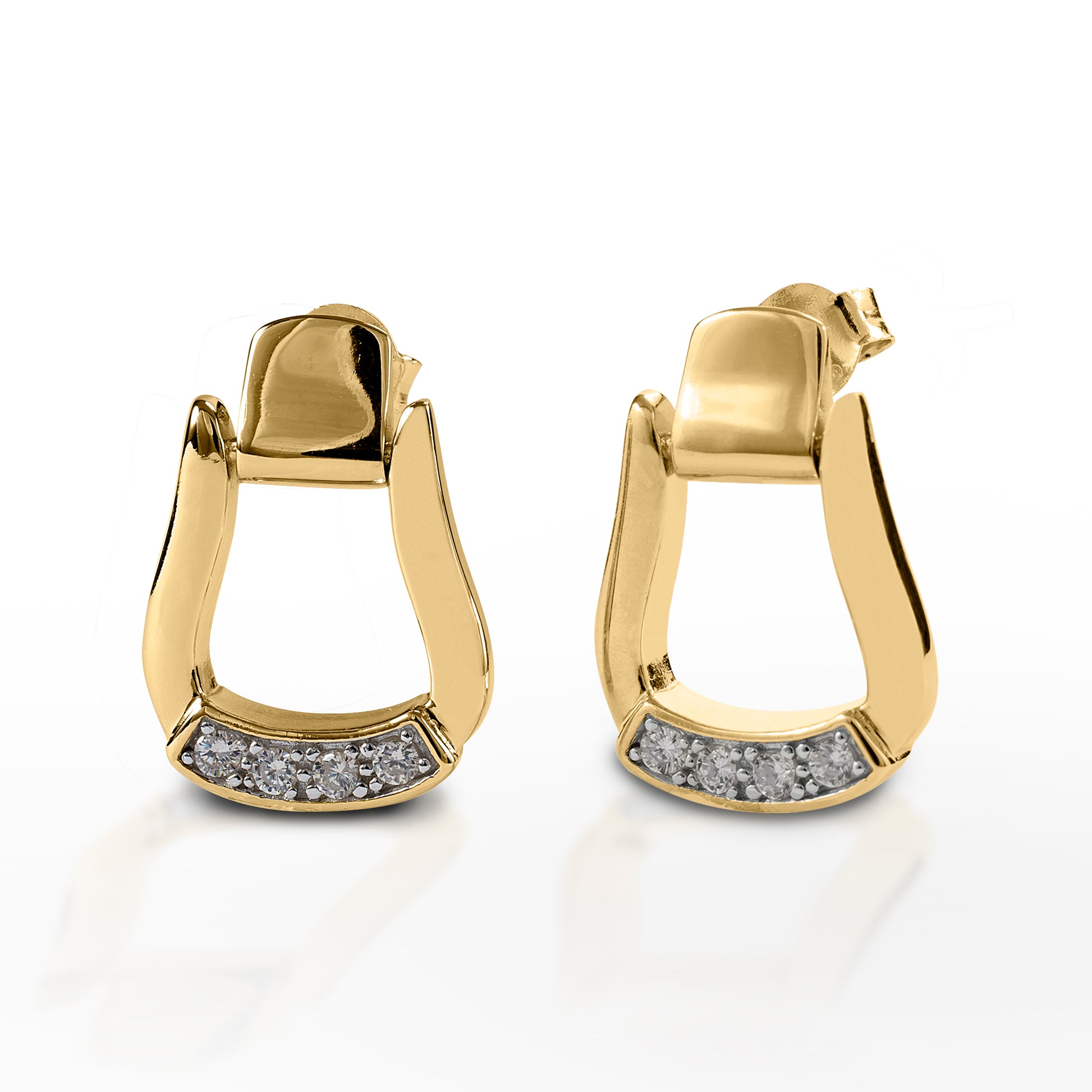 Cowgirl up with Kelly Herd Oxbow Stirrup Earrings! These earrings manage to be both elegant and authentic at the same time. Made of your choice of white or yellow gold, they feature an oxbow stirrup shape with diamond stirrup pads. These earrings have post backs, making them comfortable for all day wear.  Features      Western oxbow stirrup shaped earrings.     Diamonds     Post backs     Available in white, or yellow 14k gold     12mm x 18mm