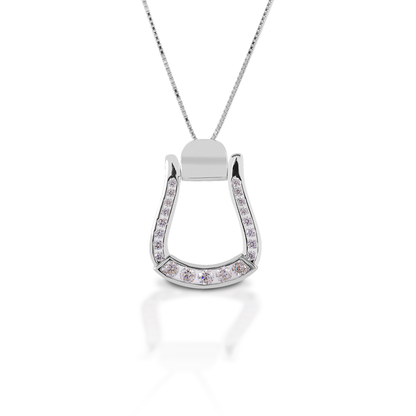 Add some Cowgirl sparkle to your look with the Kelly Herd Oxbow Clear Stone Stirrup Necklace. This necklace features an Western oxbow stirrup shaped pendant, fully enhanced with clear CZ. Made of sterling silver, this pendant will catch the light and grab attention! It comes with an adjustable 16-18" chain.  Features      Western oxbow stirrup shaped pendant.     Enhanced with clear cubic zirconia all the way around the stirrup.     Sterling Silver     Adjustable 16-18" chain     19mm x 28mm
