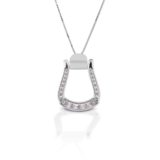Add some Cowgirl sparkle to your look with the Kelly Herd Oxbow Clear Stone Stirrup Necklace. This necklace features an Western oxbow stirrup shaped pendant, fully enhanced with clear CZ. Made of sterling silver, this pendant will catch the light and grab attention! It comes with an adjustable 16-18" chain.  Features      Western oxbow stirrup shaped pendant.     Enhanced with clear cubic zirconia all the way around the stirrup.     Sterling Silver     Adjustable 16-18" chain     19mm x 28mm