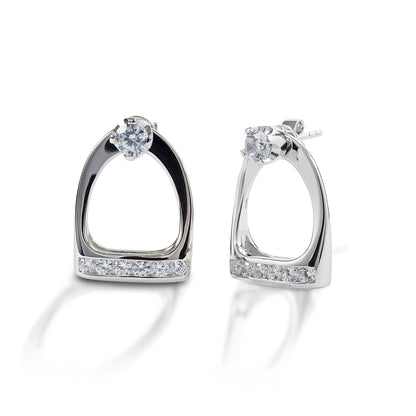 Go classic or go equestrian! With Kelly Herd Stud Earrings & Large English Stirrup Jackets you can choose. These clear cubic zirconia stud earrings come with English stirrup shaped jackets; wear the studs alone or with the jackets for an equestrian touch. Crafted in sterling silver, these earrings would make a great gift for the English equestrian in your life.  Features      Solitaire stud earrings     Removable English stirrup jackets     Clear CZ stones     Sterling Silver     14mm x 20mm