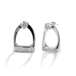 Go classic or go equestrian! With Kelly Herd Stud Earrings & Large English Stirrup Jackets you can choose. These clear cubic zirconia stud earrings come with English stirrup shaped jackets; wear the studs alone or with the jackets for an equestrian touch. Crafted in sterling silver, these earrings would make a great gift for the English equestrian in your life.  Features      Solitaire stud earrings     Removable English stirrup jackets     Clear CZ stones     Sterling Silver     14mm x 20mm