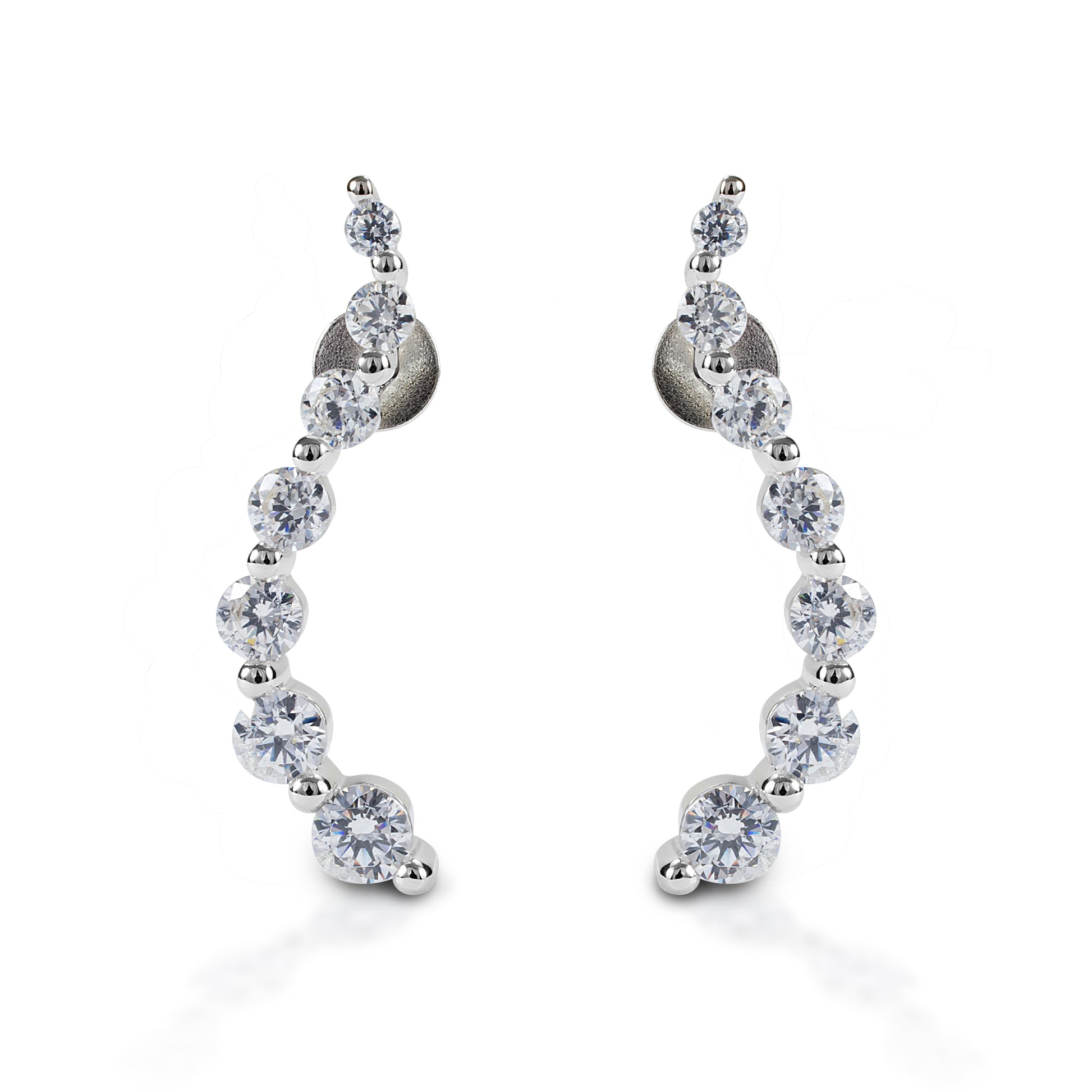 Kelly Herd Journey Earrings will be an elegant addition to your jewelry wardrobe. These stud earrings feature a curved line of graduated sized stones. Sterling silver with clear cubic zirconia stones. These earrings would make a perfect anniversary or graduation gift for a special someone!  Features      Elegant "journey" style earrings     Sterling silver with clear cubic zirconia stones     Stud backs     23mm x 4mm