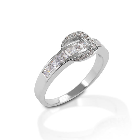 The Kelly Herd Contemporary Buckle Ring is made of white or yellow gold, with diamonds set in a belt and buckle style. It is clean lined and simple; more English show belt than large rodeo buckle.  Features      English show belt style ring     Diamonds     Available in white gold, or yellow gold     8mm wide