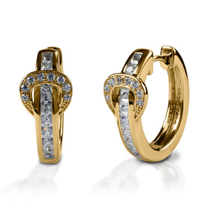 A fun take on classic hoop earrings! Kelly Herd Contemporary Buckle Earrings take the form of a simple show belt. Made of white or yellow gold, the "belt" is set with square pavé diamonds, while the "buckle" has round stones.  Features      Buckle and belt shaped hoop earrings     Diamonds     White or yellow gold     8mm x 17mm
