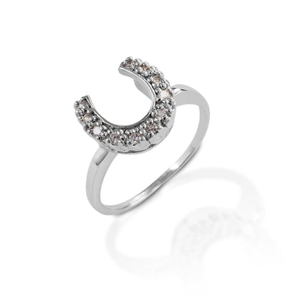 Simple, yet classic, the Kelly Herd Horseshoe Ring features a horseshoe made of clear CZ stones. The band is slender and understated, creating a lovely minimalist look. Sterling Silver.  Features      Horseshoe ring with slender band     Clear round cubic zirconia stones     Sterling Silver     12mm wide