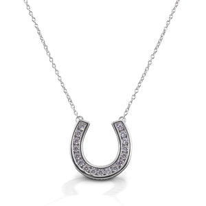 With the Kelly Herd Contemporary Pavé Horseshoe Necklace you can carry your lucky charm with you always! This clean lined horseshoe pendant features clear cubic zirconia stones set in sterling silver. Of course the horseshoe opens up so the luck doesn't fall out! Come with 16-18" adjustable chain.