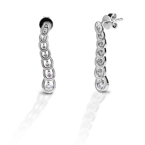 Show how your love grows with every step with the Kelly Herd Horseshoe Journey Earrings! The graduated sterling silver horseshoes are enhanced with 7 graduated clear cubic zirconia stones. The horseshoes are so detailed you can see the tiny little grooves. A matching necklace is also available.   Features      Graduated Horseshoes enhanced with Cubic Zirconia Stones     22mm x 4mm     Sterling Silver     Post backs