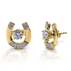 Kelly Herd Horseshoe Jacket Stud Earrings offer subtle equestrian style with flexibility! These white, or yellow 14k gold earrings feature horseshoe jackets over a diamond stud earring with sterling silver post. Wear them with the jacket for some equestrian bling, or without when you want a simple, classic look.  Features      Stud earrings with horseshoe jackets     Diamond stud     Available in white, or yellow 14k gold     12mm x 12mm