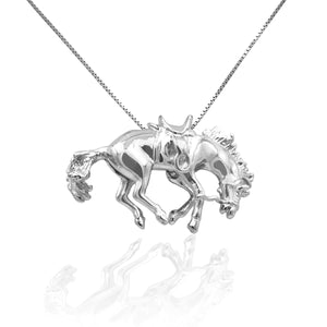 Whether you're a competitor or a spectator this pendant necklace is sure to evoke the freedom of the rodeo lifestyle. The Kelly Herd Bucking Saddle Bronc Pendant emotes the spirit of the horse and displays the spirit of the person wearing it.  Comes with 16-18" adjustable chain.