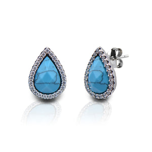 The Kelly Herd Teardrop Turquoise Earrings have a contemporary western appeal. They expertly compliment the very latest in Southwest style. The turquoise details of the teardrops are accented with brilliantly sparkling cubic zirconia stones. These pair perfectly with the Kelly Herd Turquoise Teardrop Pendant Necklace.    Features      Western Teardrop Design     Enhanced with Clear Cubic Zirconia Stones     Post Backs      Sterling Silver     Measures 14mm high and 10mm wide