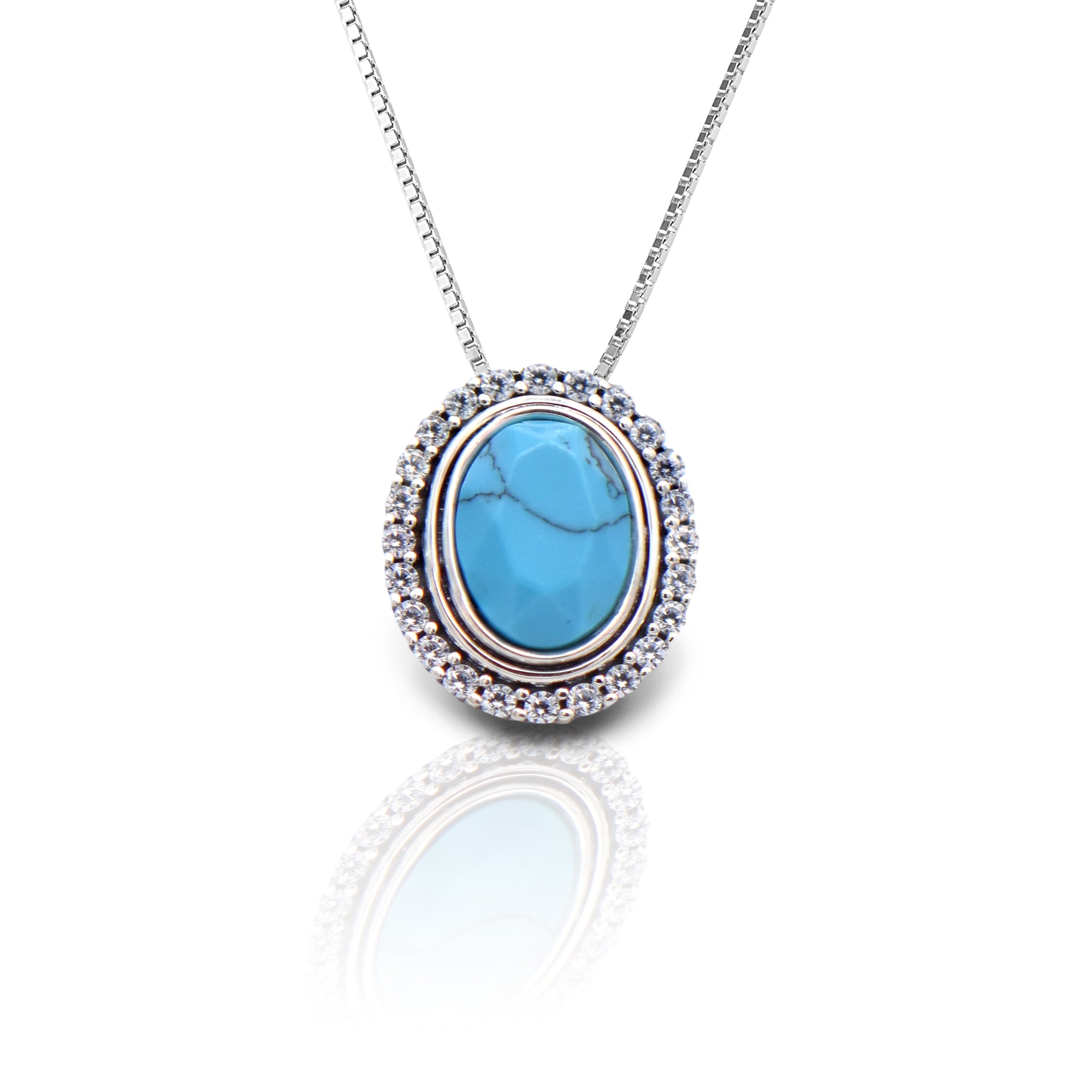 The Kelly Herd Oval Turquoise Pendant Necklace is the perfect compliment to any Western look. Whether it's a night celebrating on Sundance Square or boot scootin' down Broadway this piece will complete any ensemble. Comes with a 16"-18" adjustable box chain.  Features      Western Oval Design     Lab Turquoise Stones Enhanced with Cubic Zirconia      Measures 17mm high x 14mm wide     16"-18" Adjustable Box Chain     Matching Earrings Available     Sterling Silver