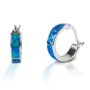 Kelly Herd Blue Opal Hoop Earrings are wide hoops with inlaid opal. The earrings and wires are made of sterling silver.  Features      Hoop style earrings     Made of sterling silver     Opal centers     Matching buckle ring available