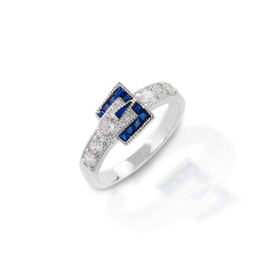 The Kelly Herd Blue Spinel Buckle Ring is sharply angle and somewhat more slender than the other Kelly Herd buckle rings. This gives the ring a more refined appearance. It is perfect for someone with a more slender hand, or looking for a more delicate piece. Made of sterling silver and cubic zirconia.