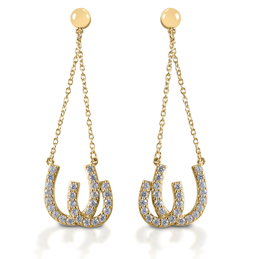 Kelly Herd Double Horseshoe Earrings are dramatic double horseshoe earrings enhanced with diamonds. The horseshoes hang on chains from post backs, giving them movement and the ability to catch the light. Available in your choice of white, or yellow 14k gold. Matching necklace is available.  Features      Dangle earrings with double horseshoes     Diamonds     Available in white gold, or yellow gold     Post backs     11mm x 38mm