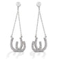 Kelly Herd Double Horseshoe Earrings are dramatic double horseshoe earrings enhanced with diamonds. The horseshoes hang on chains from post backs, giving them movement and the ability to catch the light. Available in your choice of white, or yellow 14k gold. Matching necklace is available.  Features      Dangle earrings with double horseshoes     Diamonds     Available in white gold, or yellow gold     Post backs     11mm x 38mm