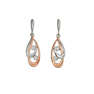 Do you favor a clean lined modern vibe? Kelly Herd's Rose Gold and Silver Double Teardrop Earrings will be the perfect match to your modern lifestyle! These sleek earrings have one rose gold loop and one sterling silver loop, each centered with a cubic zirconia single stone.  Features:      Double teardrop shape     Sterling silver and rose gold     Cubic zirconia stones     Matching necklace available