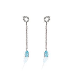 An ode to the Southwest, the Kelly Herd Blue Topaz Fixed Lariat Earrings are crafted in stunning sterling silver.  Reminiscent of a cowboy's lasso the hondos are accented with clear cubic zirconia stones and the tail is finished with teardrop cut sky blue topaz stones. These are a delicate reminder of your passion for equestrian style. These earrings are a perfect addition to the Kelly Herd Blue Topaz Fixed Lariat Necklace.