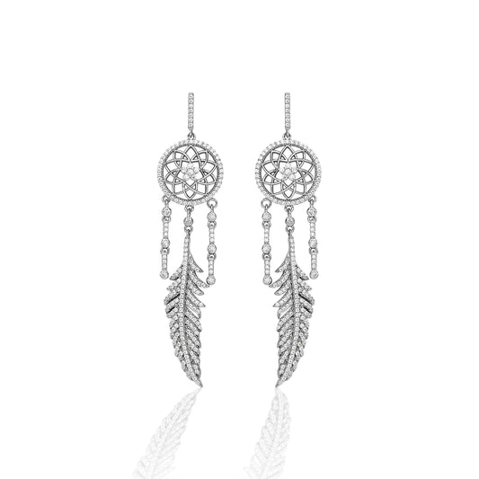The traditional dream catcher is truly a symbol of the Southwest. We designed the Kelly Herd Dream Catcher Dangle Earrings to evoke that protective nature. Our design is accented with dazzling silver feathers and clear cubic zirconia stones. Make dreams come true by adding the matching necklace!     Features      Intricate Dream Catcher Design     Clear Cubic Zirconia Stones     Measures 55mm high and 20mm wide     Post Back     Sterling Silver