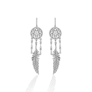 The traditional dream catcher is truly a symbol of the Southwest. We designed the Kelly Herd Dream Catcher Dangle Earrings to evoke that protective nature. Our design is accented with dazzling silver feathers and clear cubic zirconia stones. Make dreams come true by adding the matching necklace!     Features      Intricate Dream Catcher Design     Clear Cubic Zirconia Stones     Measures 55mm high and 20mm wide     Post Back     Sterling Silver