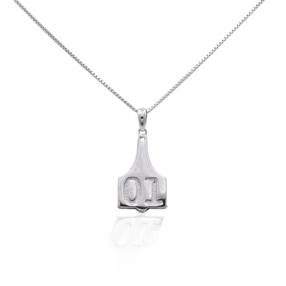 Are you looking for a unique interpretation of a farm classic? Add a touch of the farm to any outfit with our ear tag pendant. Rock this pendant with confidence wherever your daily adventures take you!   Features      Small Ear Tag Pendant Design      16"-18" adjustable box chain with spring clasp     Sterling Silver     Measures 10 mm x 25 mm