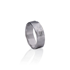 Bringing back the 1970's, this boldly styled ring is made of sterling silver with a hammered texture.  Its simple and elegant design adds a touch of retro cool to any look and makes this ring perfect for both casual or formal wear. This ring is a future heirloom that you can pass down for generations to come.  Features      Hammered Design      Sterling Silver      Comfortable Weight      5 mm wide