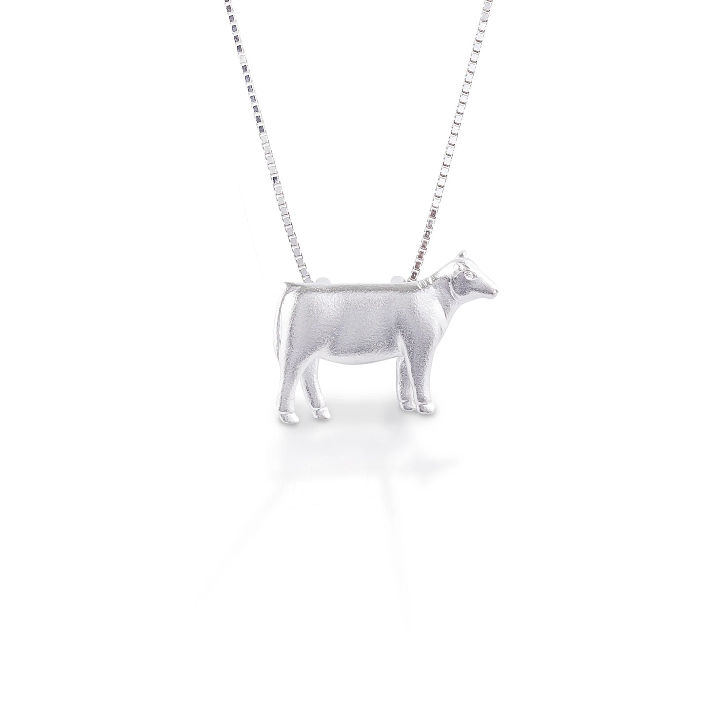 There's no doubt about it—we love our heifers. With this necklace adorning you you'll be ready to moo at the moon, or maybe even listen to your favorite country song. This pendant necklace will quickly become your go-to barn accessory and is made from lightweight sterling silver that won't weigh you down. Comes with a 16"-18" adjustable chain.   Features      Beautifully Rendered Heifer Pendant      Brushed finish      Measures 12 mm x 18 mm      16"-18" Adjustable Box Chain     Sterling Silver