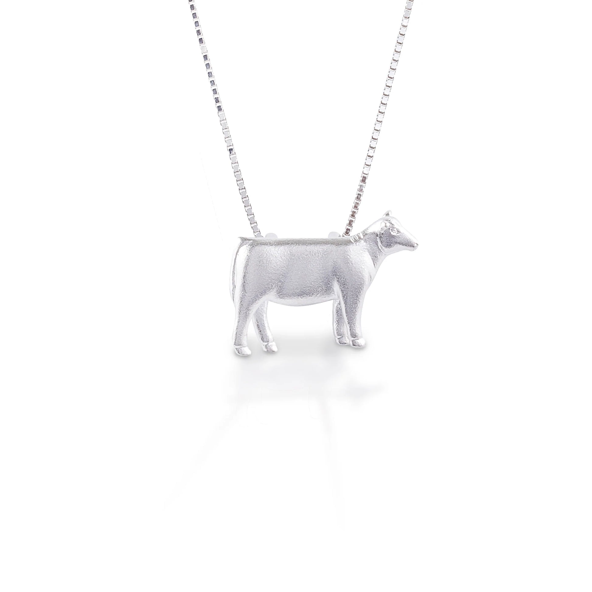 There's no doubt about it—we love our heifers. With this necklace adorning you you'll be ready to moo at the moon, or maybe even listen to your favorite country song. This pendant necklace will quickly become your go-to barn accessory and is made from lightweight sterling silver that won't weigh you down. Comes with a 16"-18" adjustable chain.   Features      Beautifully Rendered Heifer Pendant      Brushed finish      Measures 12 mm x 18 mm      16"-18" Adjustable Box Chain     Sterling Silver