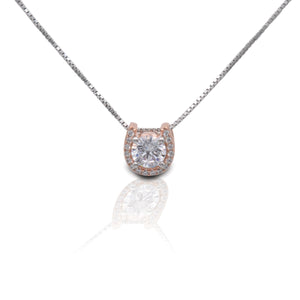     Horseshoe Solitaire Design     14K Rose Gold Plated Horseshoe     Enhanced with Clear Cubic Zirconia Stones     Measures 10mm high and 10mm wide     Includes 16"-18" Adjustable Box Chain     Sterling Silver