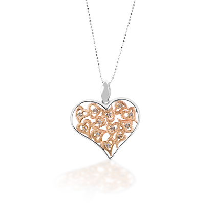 The Kelly Herd Clear Multi-Heart Pendant features a large free form sterling silver heart surrounding multiple small hearts with clear cubic zirconia stones. Comes complete with adjustable chain. 