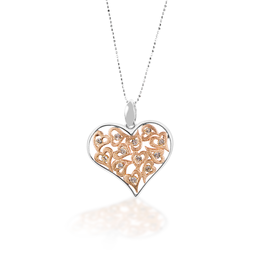 The Kelly Herd Clear Multi-Heart Pendant features a large free form sterling silver heart surrounding multiple small hearts with clear cubic zirconia stones. Comes complete with adjustable chain. 