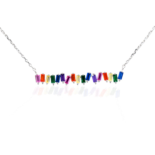 The Kelly Herd Multi-Color Bar Necklace is a must have for any jewelry collection. The baguette cut rainbow colored cubic zirconia stones are set in sterling silver featuring a 16"-18" adjustable chain, making this perfect for an easy layered style.   Features      Multi-Color baguette cut Cubic Zirconia stones     Lobster Clasp     Available in Sterling Silver