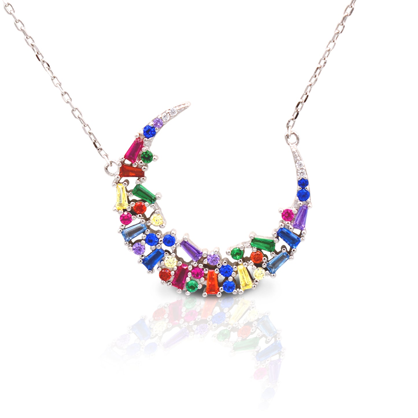 The Kelly Herd Multi-Color Crescent Necklace is simply stunning. The baguette cut rainbow colored cubic zirconia stones are set in a sterling silver crescent moon shape. This necklace features a 16"-18" adjustable chain, making this perfect for any outfit.  Features      Multi-Color baguette cut Cubic Zirconia stones     Crescent Moon setting     Lobster Clasp     Available in Sterling Silver
