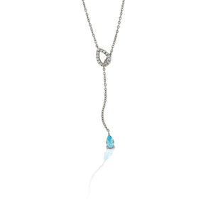 An ode to the Southwest, the Kelly Herd Blue Topaz Fixed Lariat Necklace is crafted in stunning sterling silver.  Reminiscent of a cowboy's lasso the hondo is accented with clear cubic zirconia stones and the tail is finished with a teardrop cut sky blue topaz stone. This piece is a delicate reminder of your passion for equestrian style. The necklace is a perfect compliment to the Kelly Herd Blue Topaz Fixed Lariat Earrings.