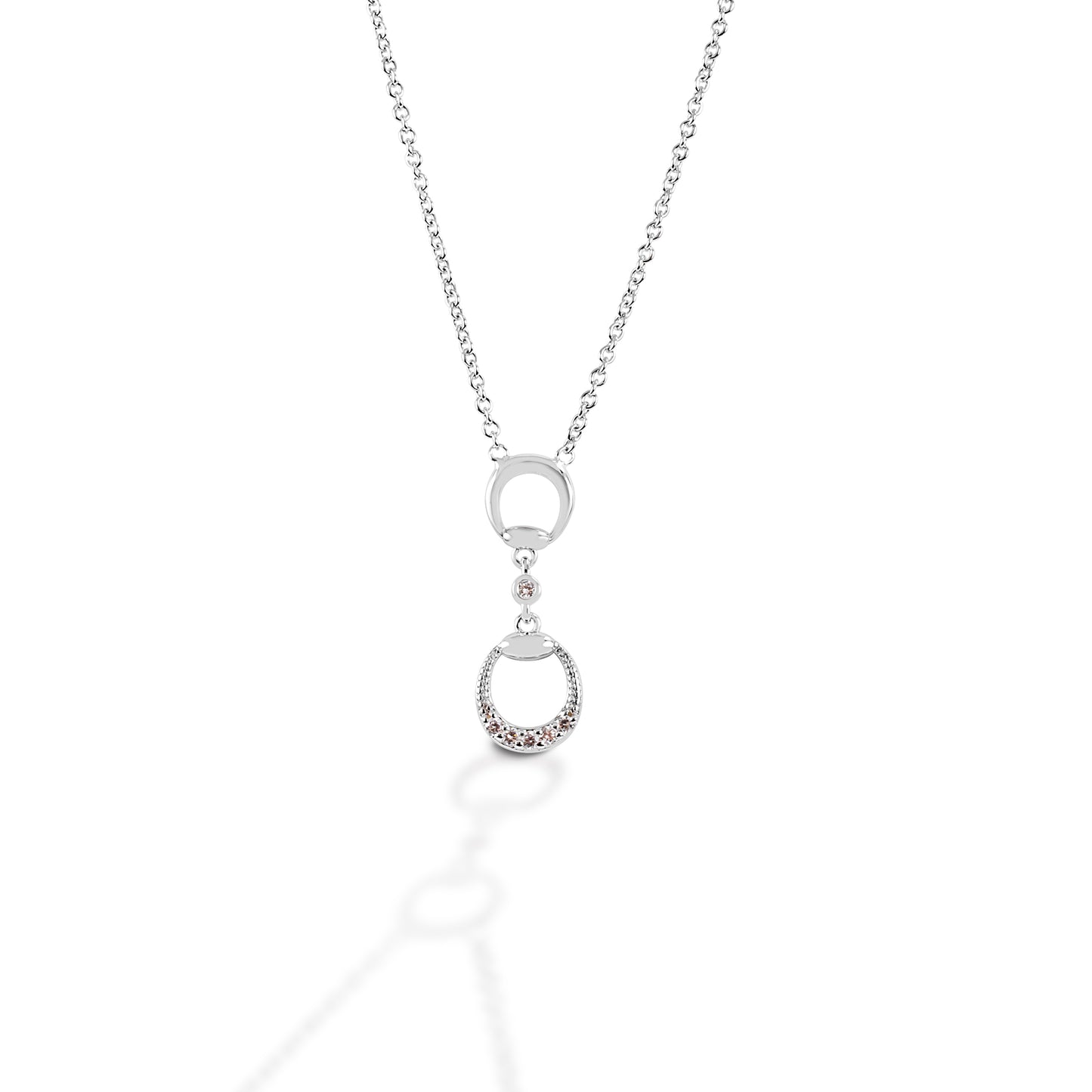 Your horse never had a bit this pretty! Kelly Herd's Eggbutt Bit Necklace has a beautiful sterling silver pendant shaped like an eggbutt snaffle bit. It feature clears cubic zirconia stones on the drop half of the earring.  Features:      Eggbutt bit shape     Sterling silver     Cubic zirconia stones