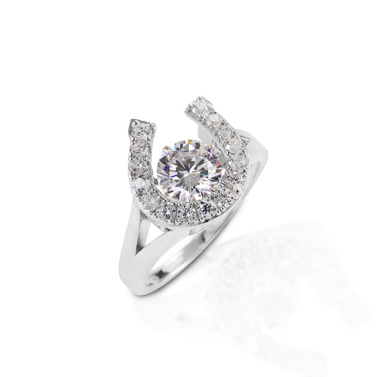 The Kelly Herd Dancing Stone Horseshoe Ring will sparkle with your every move. This sterling silver and clear CZ ring is all about movement and light. The center round CZ stone turns to add a three-dimensional element. Matching necklace and earrings are available.  Features      Horseshoe ring     "Dancing" CZ solitaire     Made of sterling silver     24mm wide