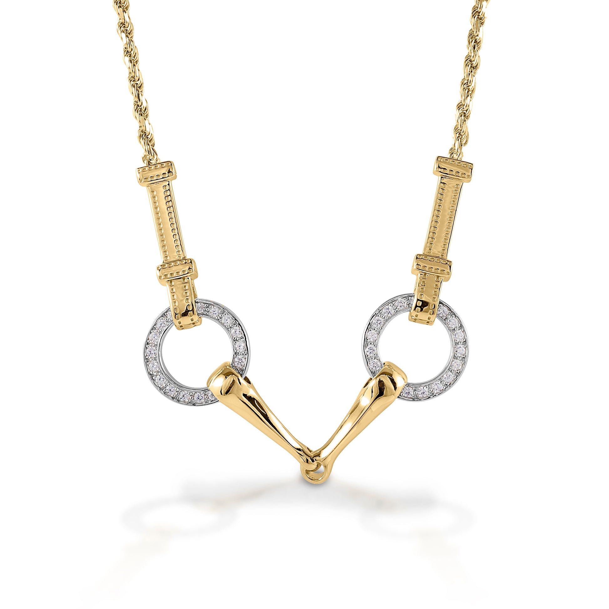 The Kelly Herd Snaffle Bit Necklace is impeccably designed. You can even see the tiny stitches on the "leather" that connects the bits. Made in 14K gold, enhanced with diamonds.  Features      Snaffle bit pendant     Enhanced with diamonds     Detailed check pieces connected it to the chain     Available in 14k gold