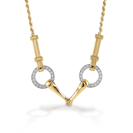 The Kelly Herd Snaffle Bit Necklace is impeccably designed. You can even see the tiny stitches on the "leather" that connects the bits. Made in 14K gold, enhanced with diamonds.  Features      Snaffle bit pendant     Enhanced with diamonds     Detailed check pieces connected it to the chain     Available in 14k gold