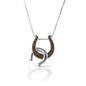 Double the luck! The Kelly Herd Double Horseshoe Necklace has one upright horseshoe enhanced with Cognac CZ stones, and another smooth, shiny one casually hooked across. This gives the necklace a fun, whimsical affect. Sterling Silver. Comes with adjustable 16-18" chain.  Features      Double Horseshoe pendant     Enhanced with Cognac CZ stones     Sterling silver     Comes with adjustable 16-18" chain     18mm x 27mm