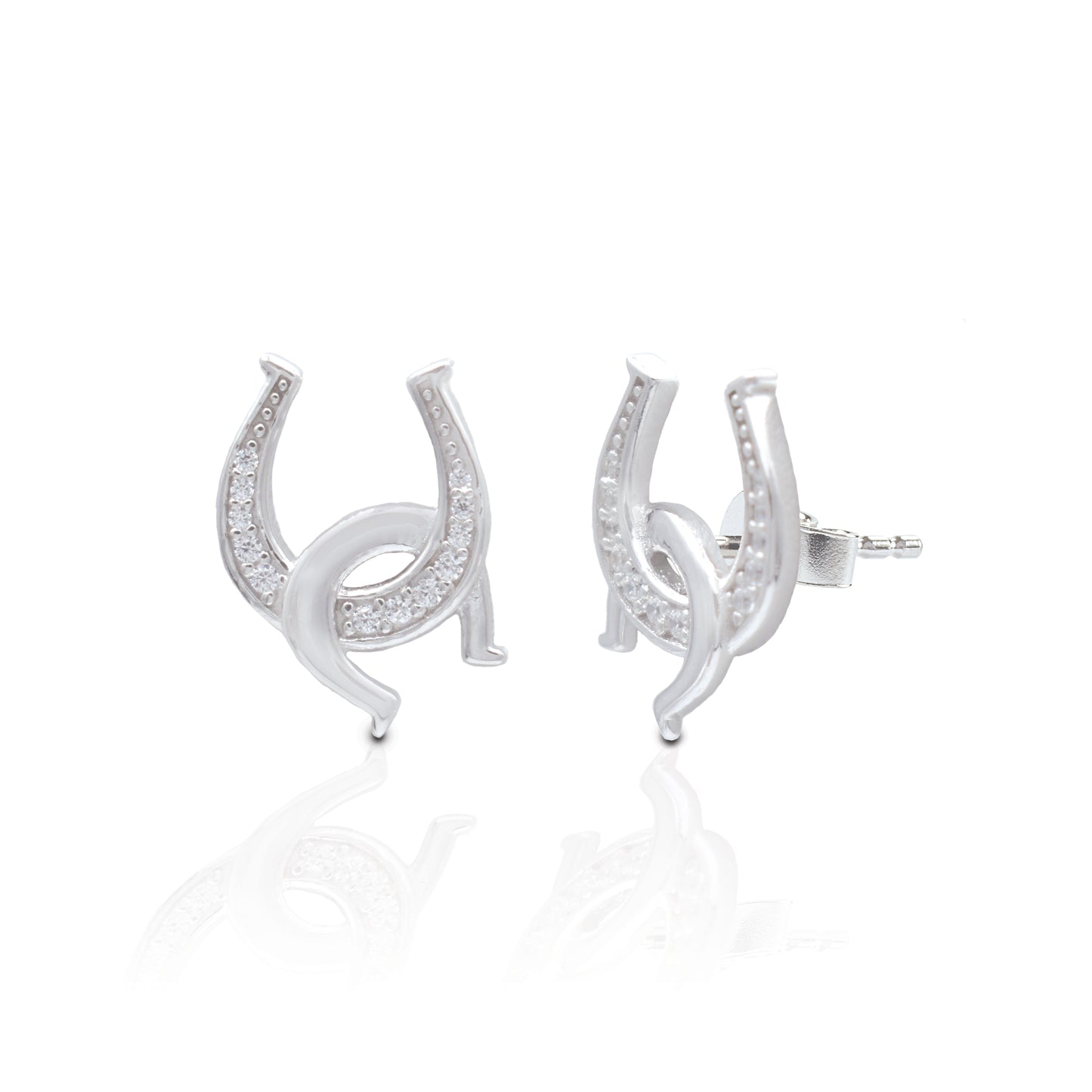 Double the luck and no matter how you wear them your luck will never run out! The Kelly Herd Clear Double Horseshoe Earrings have one upright horseshoe enhanced with clear cubic zirconia stones and an interlocking smooth one casually hooked through. They are the perfect compliment to our Kelly Herd Clear Double Horseshoe Necklace.   Features      Interlocking Horseshoe Design     Enhanced with Clear Cubic Zirconia Stones     Measures 12mm high and 7mm wide     Post Back     Sterling Silver