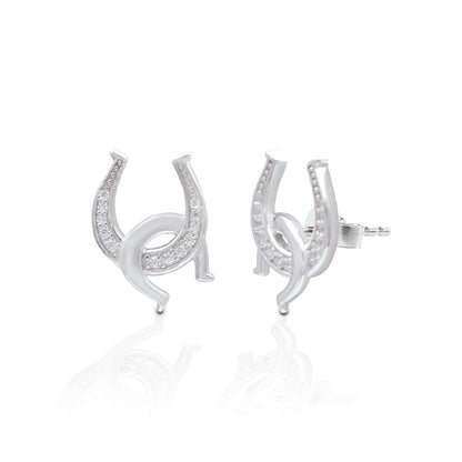 Double the luck and no matter how you wear them your luck will never run out! The Kelly Herd Clear Double Horseshoe Earrings have one upright horseshoe enhanced with clear cubic zirconia stones and an interlocking smooth one casually hooked through. They are the perfect compliment to our Kelly Herd Clear Double Horseshoe Necklace.   Features      Interlocking Horseshoe Design     Enhanced with Clear Cubic Zirconia Stones     Measures 12mm high and 7mm wide     Post Back     Sterling Silver